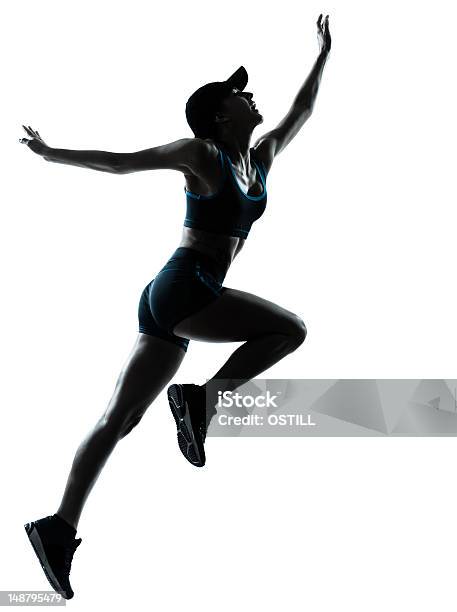 Corredor De Mujer Salto Impulsor Foto de stock y más banco de imágenes de Mujeres - Mujeres, Sólo mujeres, Adulto