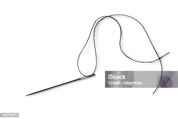 A Single Needle With Black Thread On A White Background Stock Photo - Download Image Now