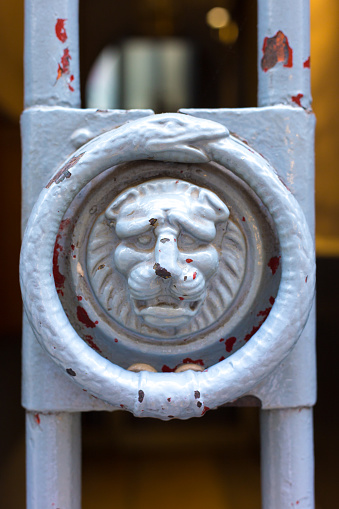 Lyon, France: Ornate Antique Lion Door Knocker Close-Up. The lion is a symbol of Lyon.