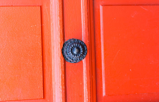 istock Lyon, France: Bright Red/Orange Door With Ornate Knob 1487960880