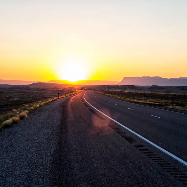 istock Sunset on Remote Western USA Wilderness Highway 1487962012