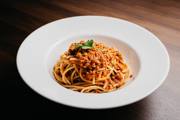Bolognese Spaghetti Ground Beef White Ceramic Bowl On Woody Table Italian Food High Resolution Stock Photo stock photo