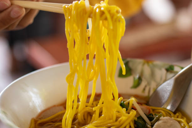 istock chopsticks to scoop noodles 1487966272