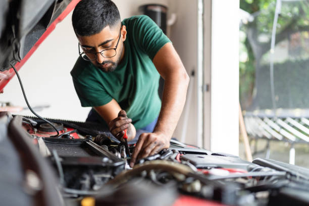 Diy at home Young person fixing car engine at home car repair stock pictures, royalty-free photos & images