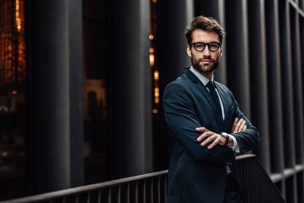 istock Smiling man outdoors in the city 1487970043