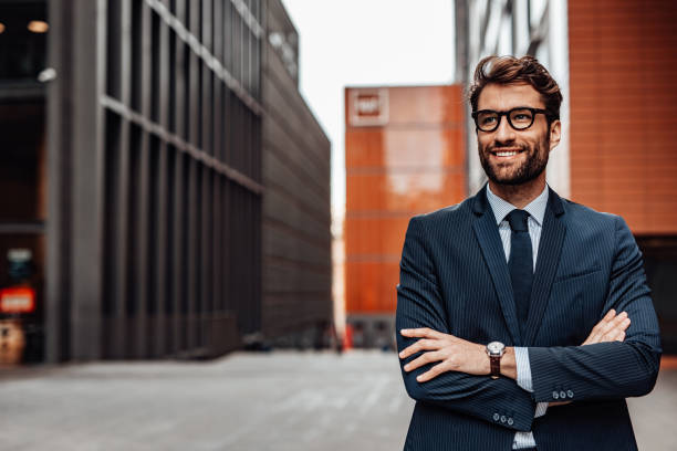 istock Smiling man outdoors in the city 1487970047
