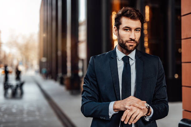 istock Smiling man outdoors in the city 1487970173