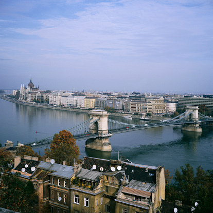 Looking from the Buda side of the Danube, out over the Danube river to the Pest side and the Széchenyi bridge, which is one of Budapest's most famous bridges.
