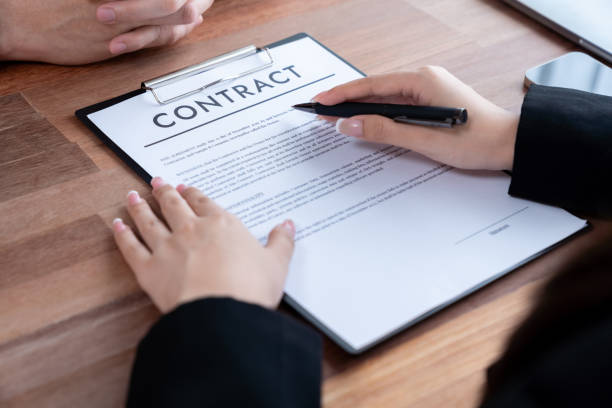istock Businessman review agreement document before signing contract. Jubilant 1487976204
