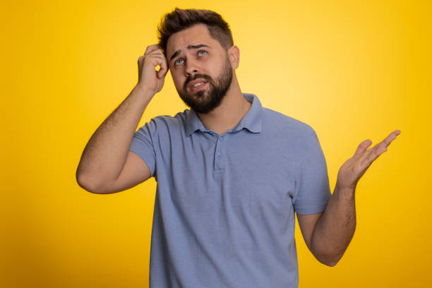 istock Puzzled clueless uncertain man raising hands in helpless, embarrassed confused by difficult question 1487976825
