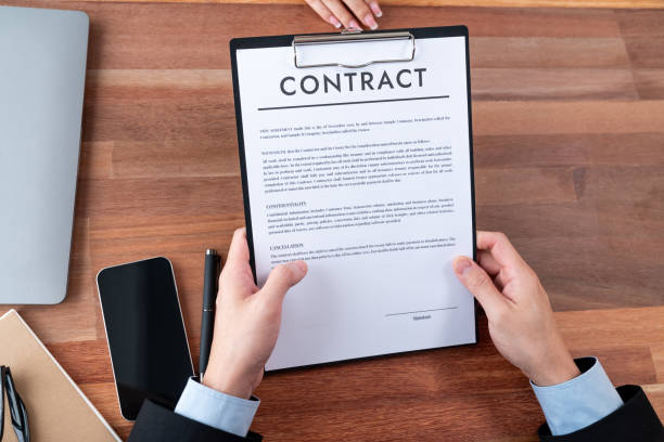 istock Businessman review agreement document before signing contract. Jubilant 1487981025
