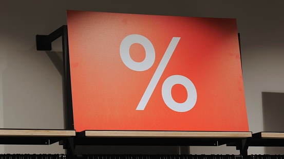A big red sign with a percentage sign. White percent sign on a red background. big sale.