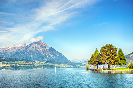Lake Thun (Thunersee) is an Alpine lake in Switzerland. Composite photo
