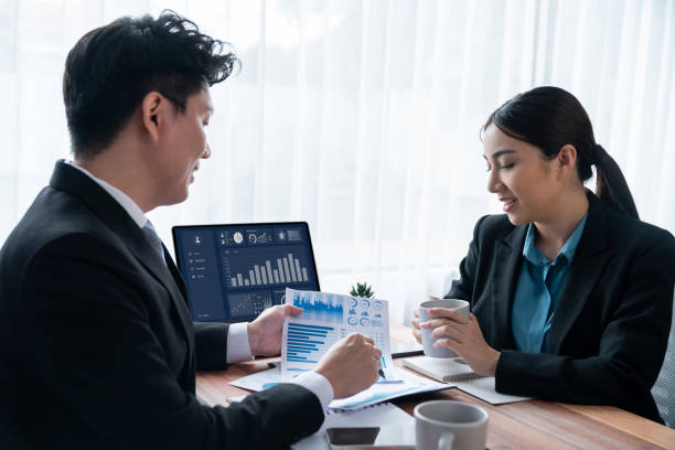 istock Busy analyst team in office discuss data analysis and marketing. Jubilant 1487985122