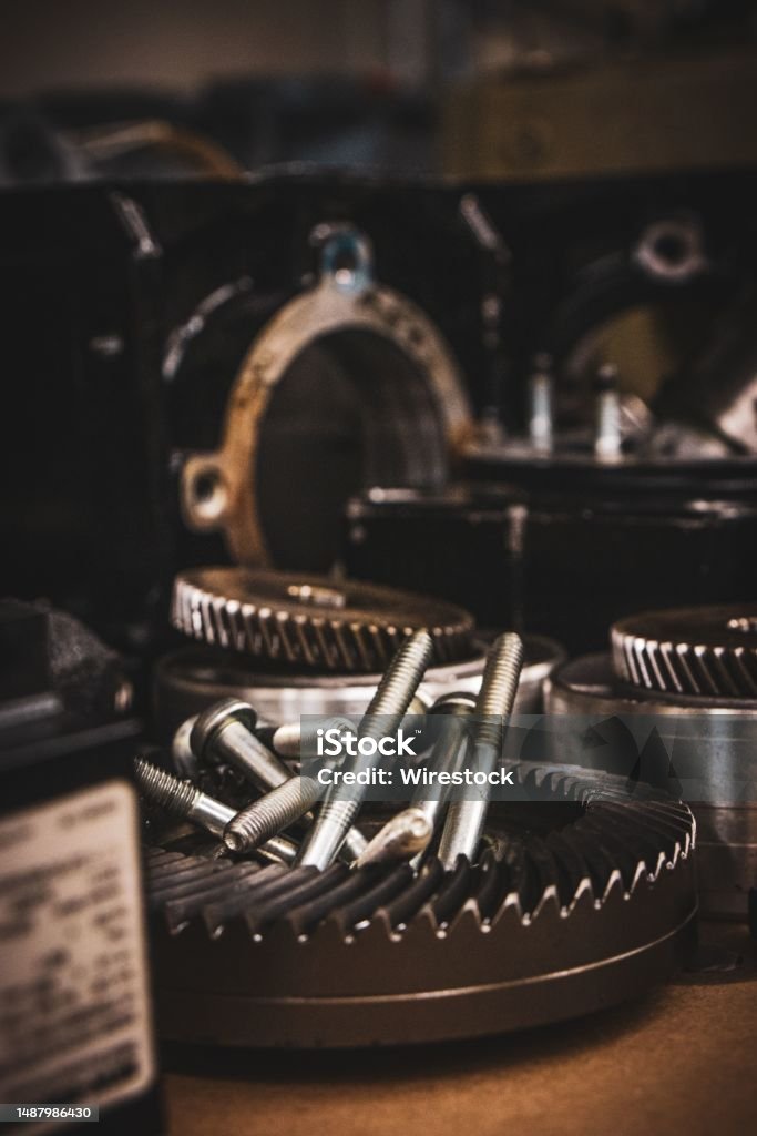 Closeup shot of various industrial pieces used for making engines for cars Close-up of various engineering components used in the production of automobile engines Bolt - Fastener Stock Photo