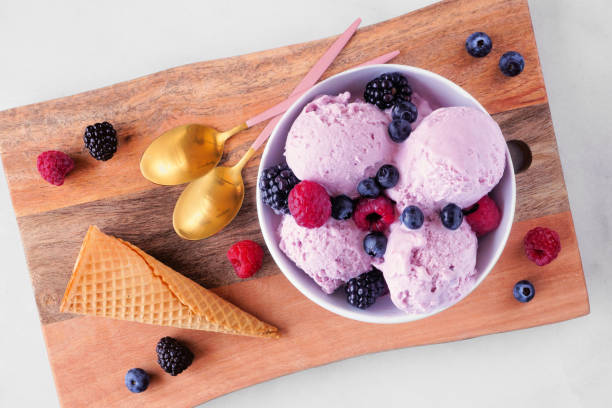 istock Field berry ice cream on a wooden serving board 1487987694