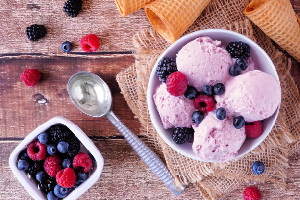 istock Field berry ice cream, above view table scene with over rustic wood 1487987760
