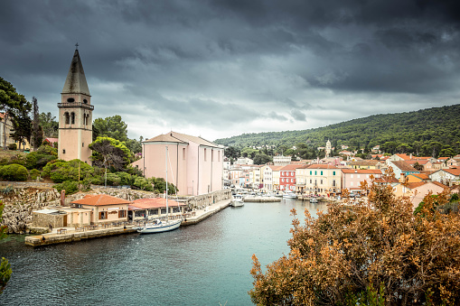 A storm closing to the Veli Lošinj s small town on the island of Lošinj . Once in a while it was an important port and fishing centre.