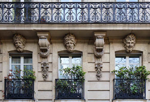 Ornamental faces on european building