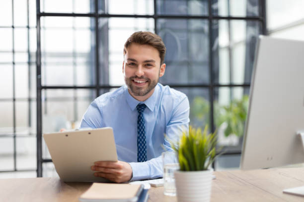 istock Successful entrepreneur is studying documents with attentive and concentrated look. 1487993008