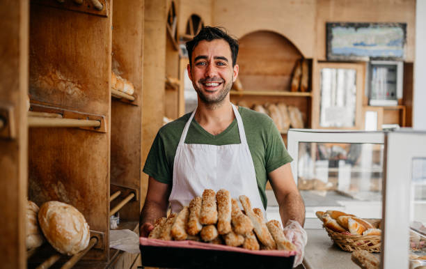 Bread seller at the bakery shop stock photo