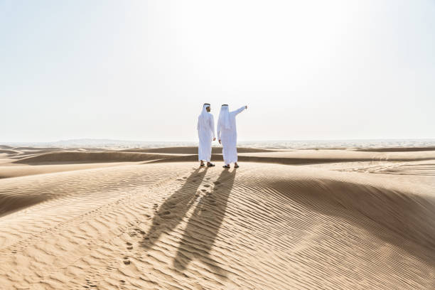 istock Two middle-eastern emirati men wearing arab kandura bonding in the desert 1487993630