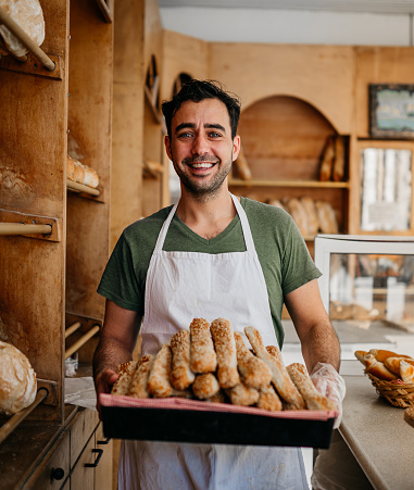 Baker with fresh pastries