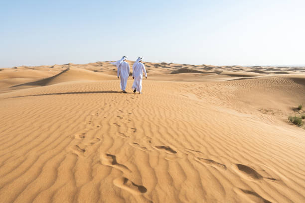 istock Two middle-eastern emirati men wearing arab kandura bonding in the desert 1487994672
