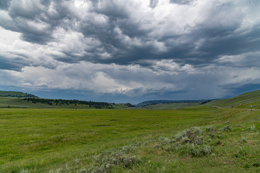 Storm clouds over Lamar Valley in the Yellowstone Ecosystem in western USA, North America. Nearest cities are Denver, Colorado, Salt Lake City, Jackson, Wyoming, Gardiner, Cooke City, Bozeman, and Billings, Montana, North America.