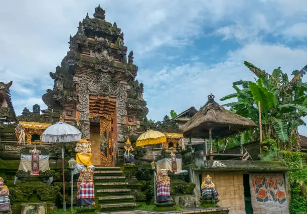 Photo of The hindu temple of the charming village of Petulu famous por its egret and heron colonies, Ubud, Bali, Indonesia