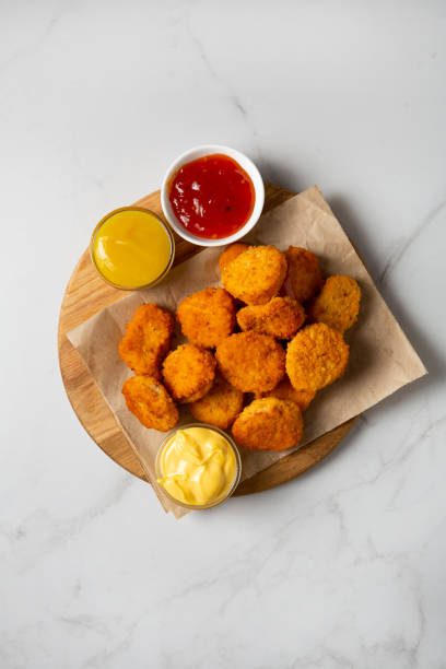 istock of chicken nuggets and dips fast food top view 1487998533