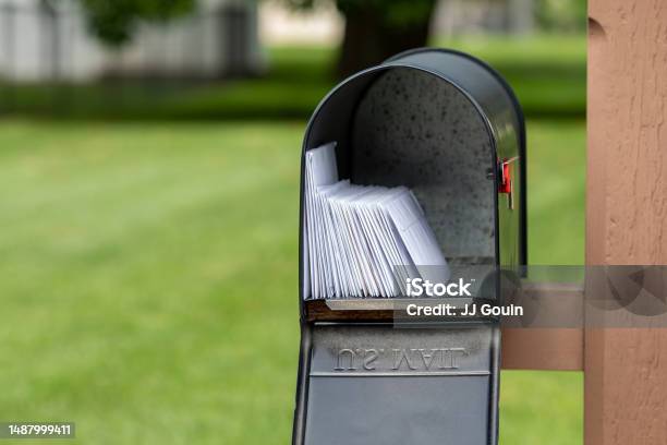 Mailbox Full Of Letters And Junk Mail Mail Delivery Post Office And Postal Service Concept Stock Photo - Download Image Now