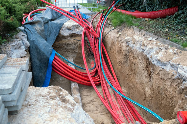 istock underground electric cable infrastructure installation. Construction site with A lot of communication Cables protected in tubes. electric and high-speed Internet Network cables are buried underground 1488005262