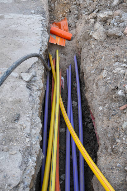 istock A lot of communication Cables protected in various color tubes. underground infrastructure installation. Construction site with electric and high-speed Internet Network cables are buried 1488005377