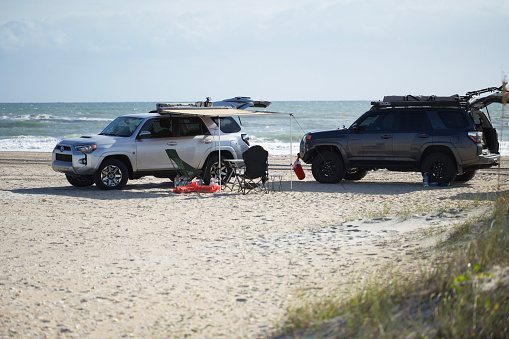Davis, North Carolina - November 24, 2022: Two Toyota 4Runners camping on the beach of Cape Lookout National Seashore in Davis, North Carolina.