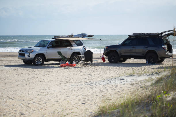 Overland camping on the beach with 4Runners stock photo