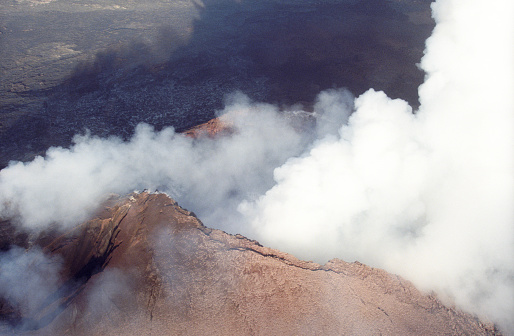 A view of the active volcanos with thick smoke in Hawaii Volcanoes National Park from a helicopter.