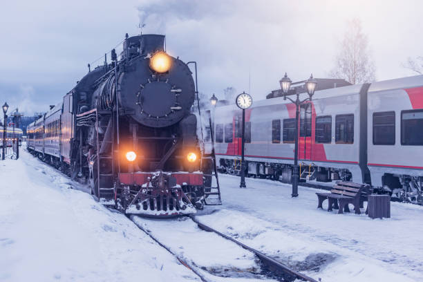 istock Retro steam train arrives at winter morning. 1488009409