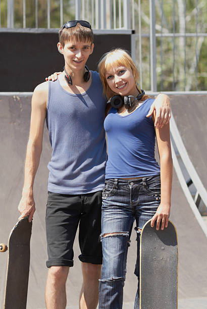 istock Teen skaters with boards in skatepark 148801232