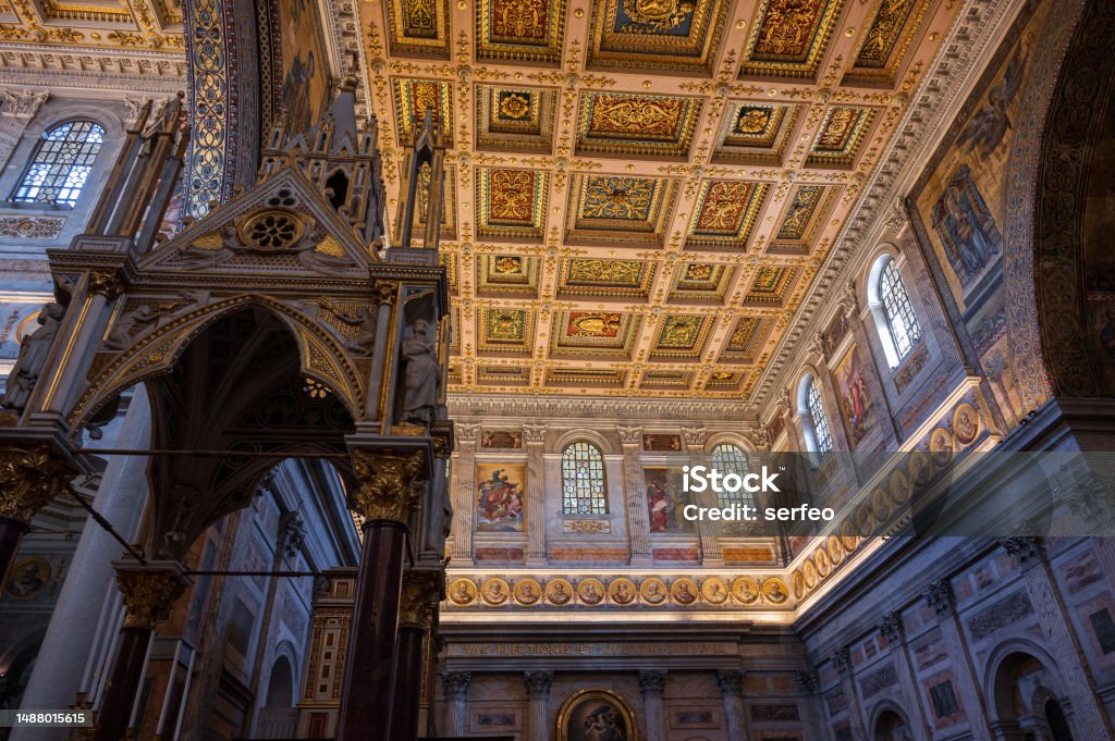 Roma. The Papal Basilica of Saint Paul Outside the Walls The Papal Basilica of Saint Paul Outside the Walls is one of the four papal basilicas of Rome. It rises along the Via Ostiense, in the district of the same name, near the left bank of the Tiber. Aisle Stock Photo