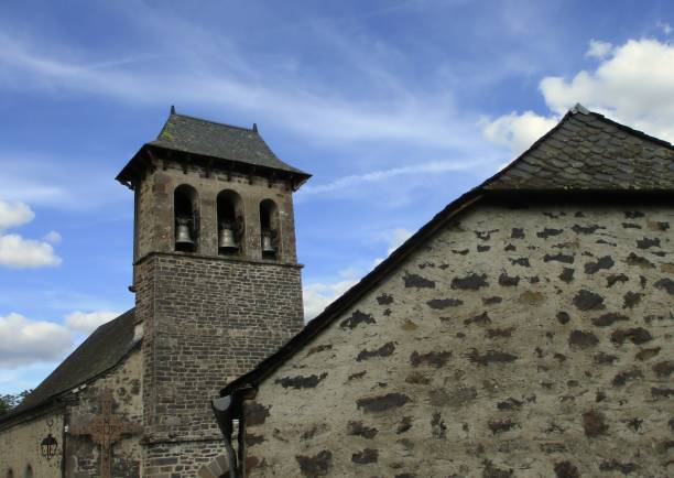 Bell tower with 3 bells of the church of Chambres, hamlet of the commune of Le Vigean, Cantal, Auvergne, France. August 2022.