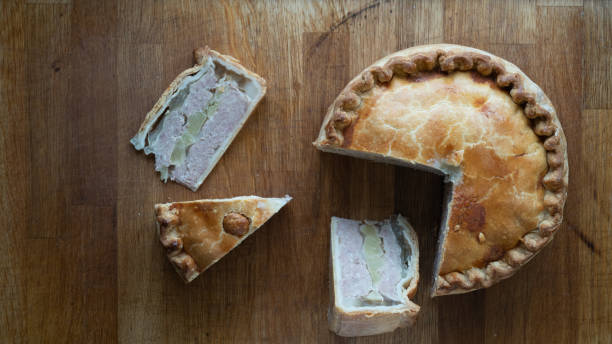 istock Savory Pork Pie Delights on Rustic Wooden Table