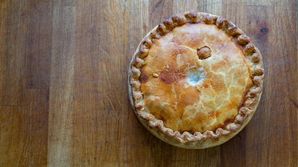istock Savory Pork Pie Delights on Rustic Wooden Table top view 1488017857