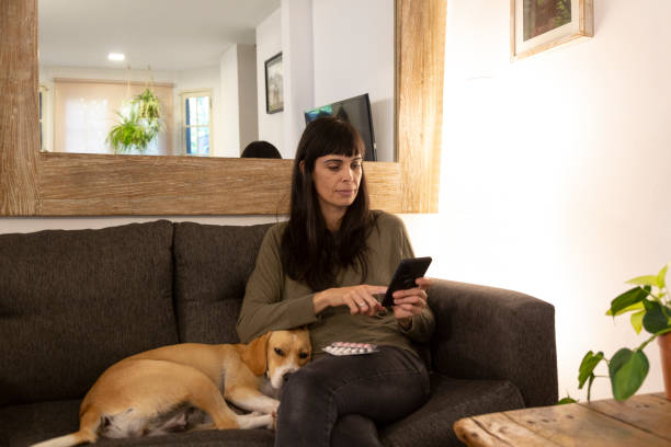istock woman at home using mobile phone 1488018896
