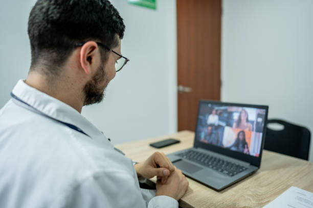 istock Doctor during a video conference on laptop at doctor's office 1488020363