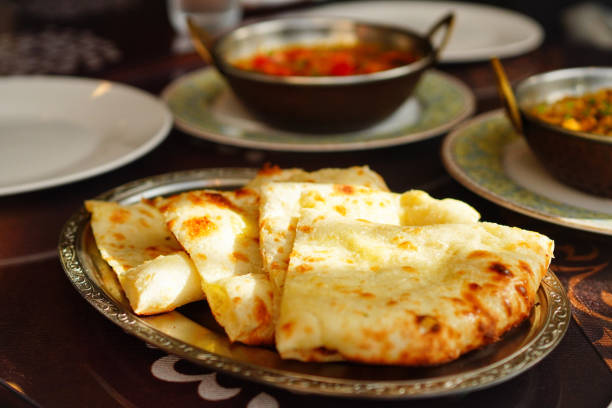 Indian bread Naan on a silver tray\t\nat authentic Indian restaurant in Kyoto, Japan