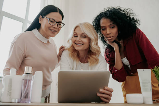istock Three confident mature women choosing beauty products online while spending time together 1488020510