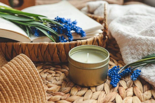 istock Candle and flowers in home atmospheric interior 1488021269