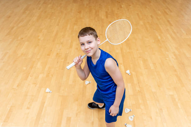 istock Kid playing badminton. Horizontal sport theme poster, greeting cards, headers, website and app 1488021471