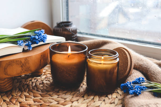 istock Two candles on a windowsill in a home interior 1488024975